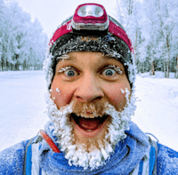 Headshot of Brandon Wood, with an icy beard after running in the cold.
